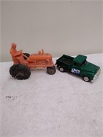 Plastic toy tractor and Ford pickup