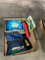 box of golf balls, repair tool, ball bag, etc.
