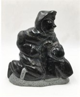 Inuit Black Stone Carving of Eskimo Man and Seal.