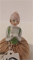 3.5” 1920’s Figural Porcelain Pin Cushion.