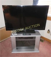 Sanyo 42" TV (w/remote) , TV stand, and VHS player