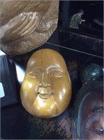 Wooden Buddha face