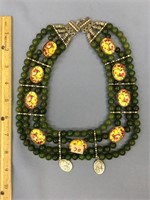 Jade necklace with inset flower pendants and assor