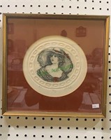 Framed artist proof of a woman in a big hat,