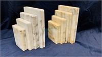 Carved white marble bookends, design to look like