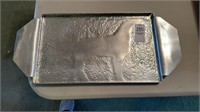 Hammered aluminum tray with dog on it