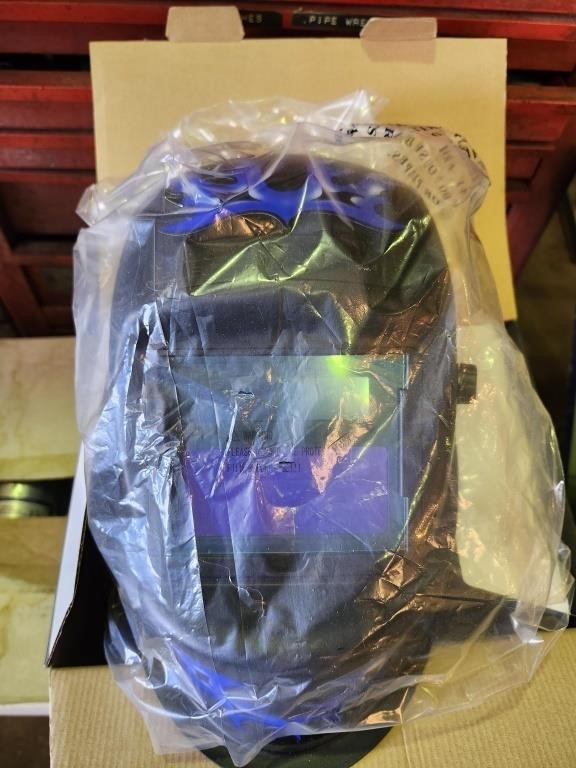 Welding helmet with blue flame design