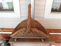 Wicker gathering / fireside basket on wooden base,