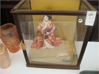 Cased Japanese doll.