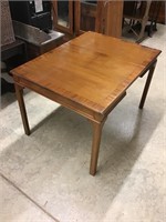 Gorgeous crotch Mahogany table with pop up leaf.