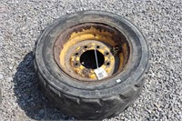 10-16.5 SKID STEER TIRE AND RIM