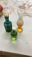 Three cologne/perfume dispensers
