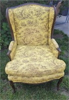 Wing back chair with yellow Williamsburg toile
