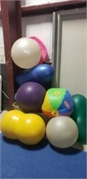 LOT OF VARIOUS YOGA BALLS, INFLATABLE BALLS, AND