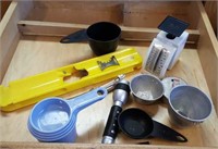 Kitchen utensils, measuring cups, peeler