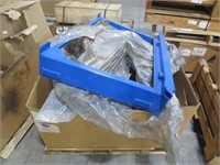 Pallet of plastic parts and a metal door frame