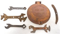 6 Farquhar Iron age items: wrenches, planter lid