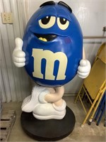 52 inch blue M&Ms rolling display.  In good