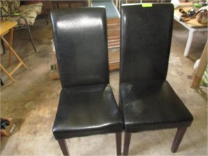 2 black straight-back chairs
