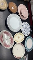 Mismatched vintage plates and platters, imperial