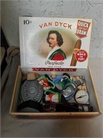 Cigar box with watches, belt buckle and