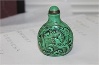 A Well Carved Peking Glass Dragon Snuff Bottle