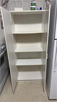 White storage shelf with contents on top