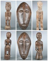 6 African masks and figures. 20th century.