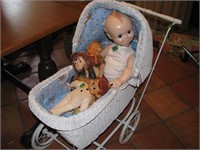 Old, wicker stroller with old dolls