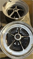 One Buick rim 15x6 and one miscellaneous rim