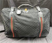 Vintage designer style suitcase marked Gucci