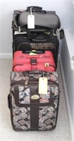 5pc luggage lot: four assorted size suitcases