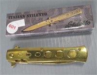 Italian stiletto folding knife in box.