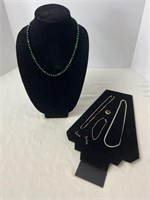 Emerald colored beaded necklace and earrings with
