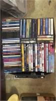 Box of assorted DVDs, CDs, & cassettes