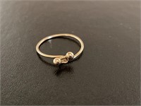 14k gold ring size 4 weighs .75 grams ring is