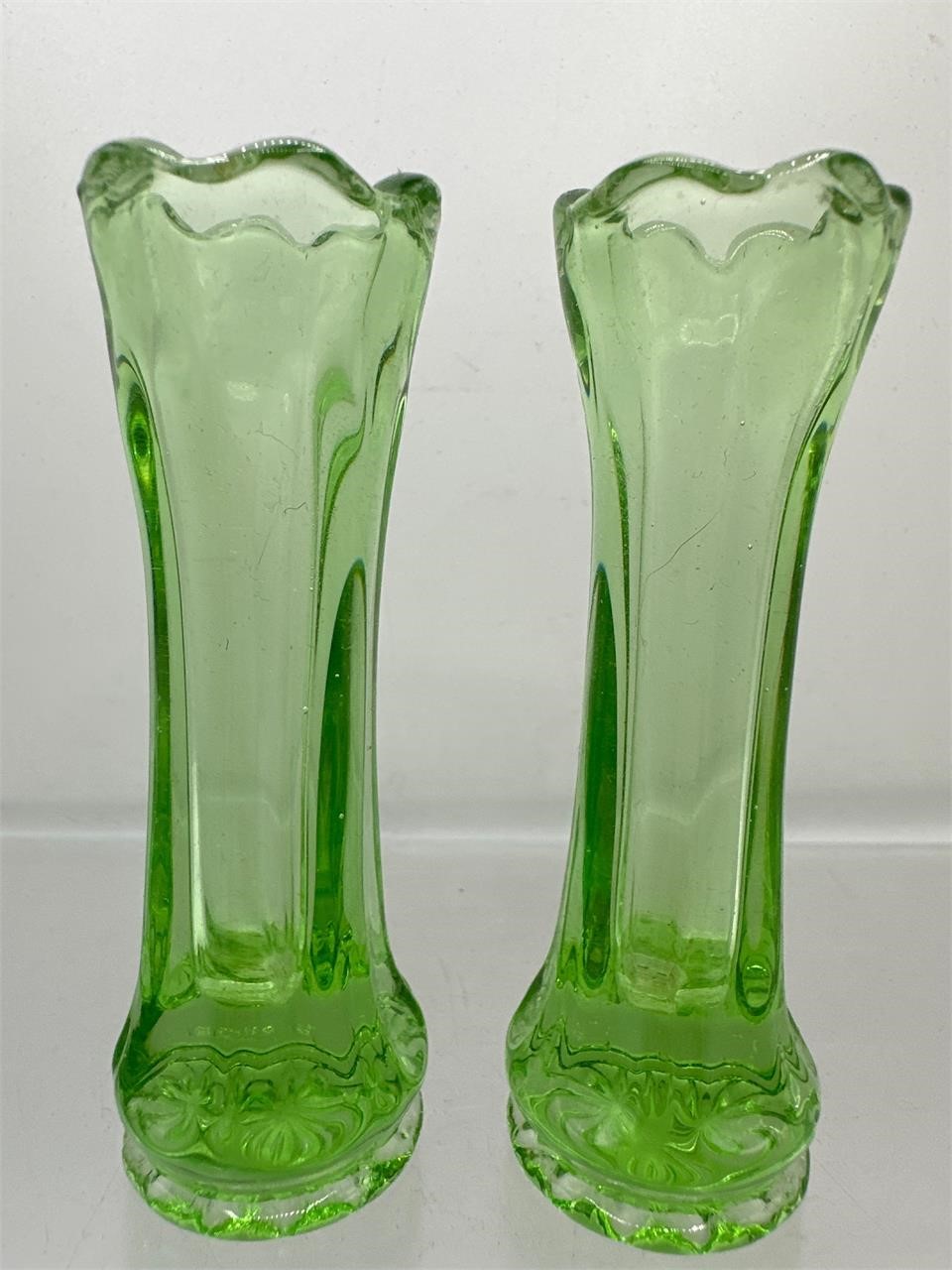 Miniature green glass bud vases