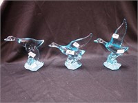 Three turquoise glass geese figurines