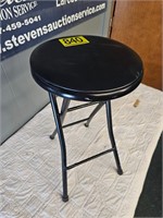 Folding black barstool with cushion