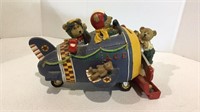 Bears in airplane themed bank of a composite