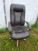 Large brown rolling swivel office chair, has some