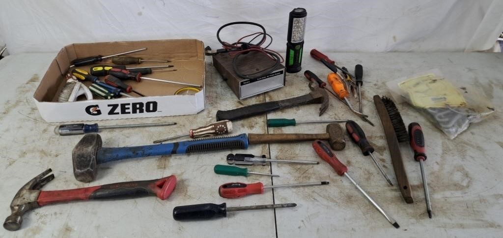 Assortment of tools, an AC power supply, and