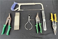 Tin snips, folding rule, hack saw and more.
