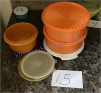 Four Tupperware containers lids