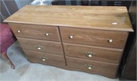 6-Drawer wood dresser. Measures: 30" H x 49" W x