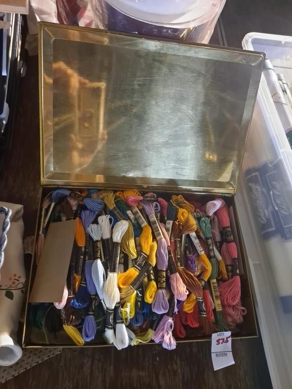 Vintage tin full of various colors of embroidery