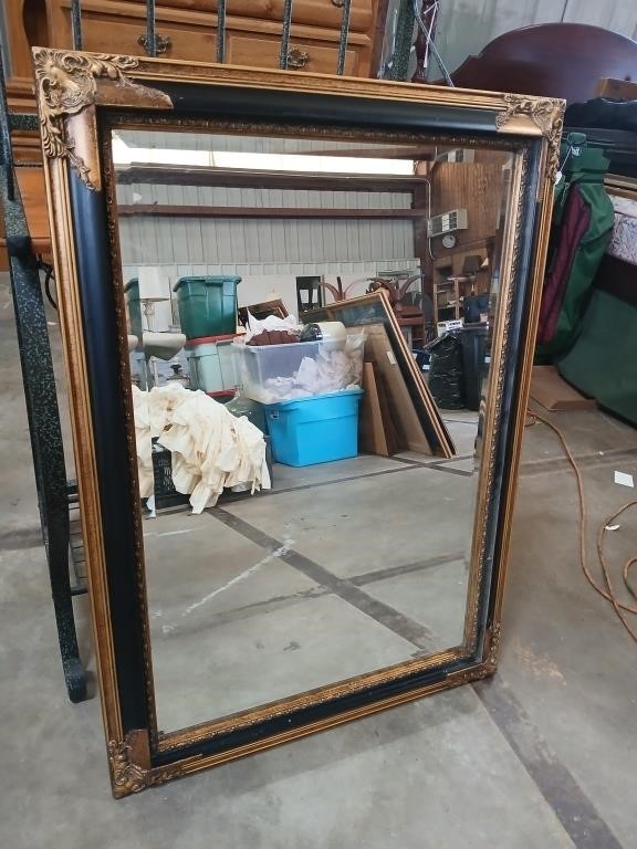 Black & gold framed mirror