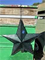 green hanging solar lighted star