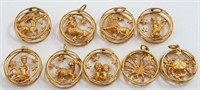 Jewelry lot (9) Zodiac 14K gold pendants by Ruser