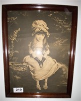 B&W print of little girl in wooden frame
